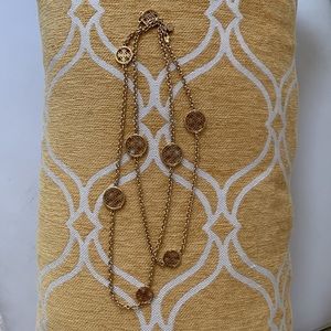 Michael Kors gold tone long, station necklace.